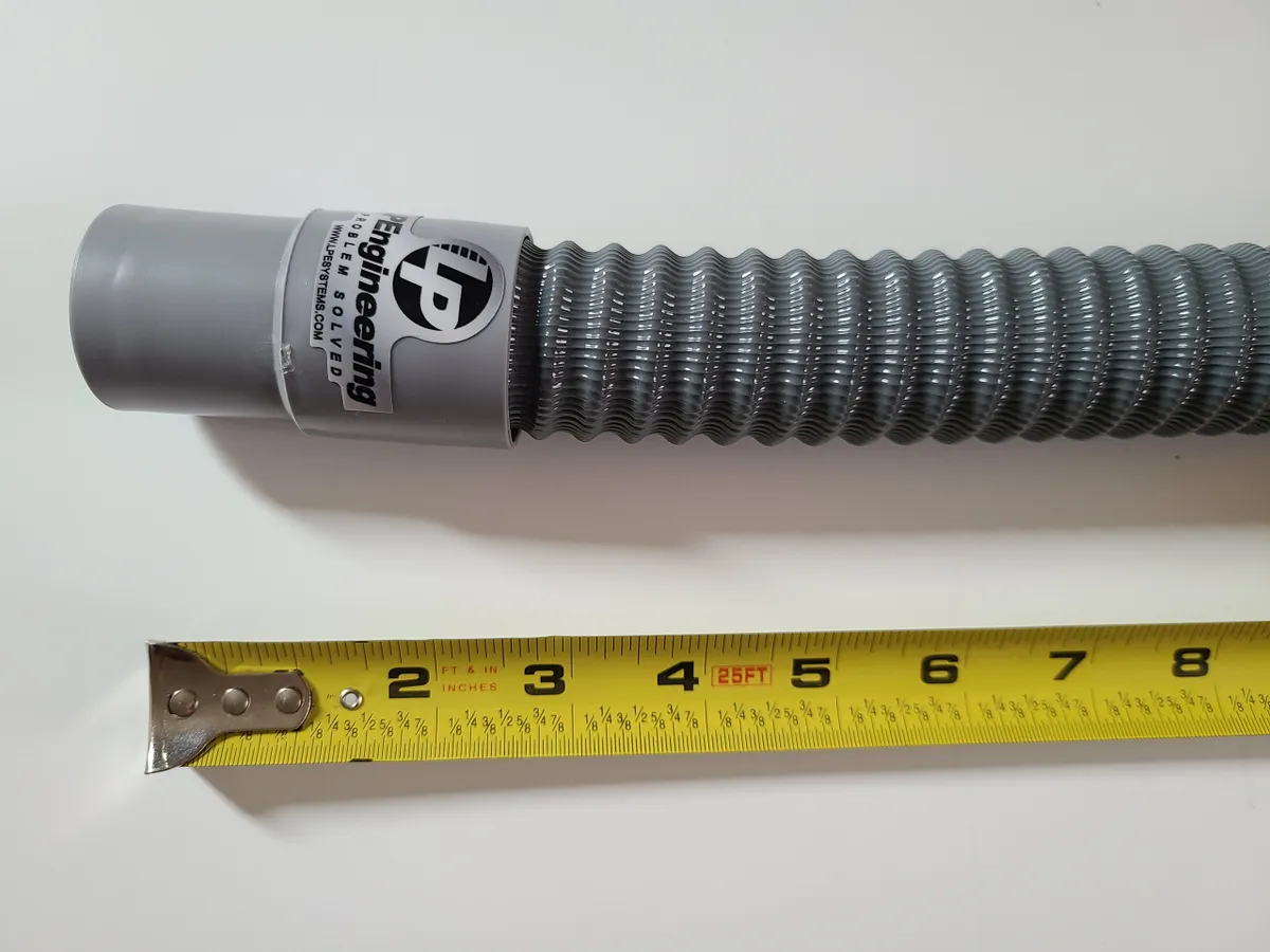 Air hose for off road helmet air pumper next to tape measure