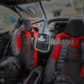 black 4 (four) hose socket air filter and air pumper with 4 hoses inside a side-by-side UTV